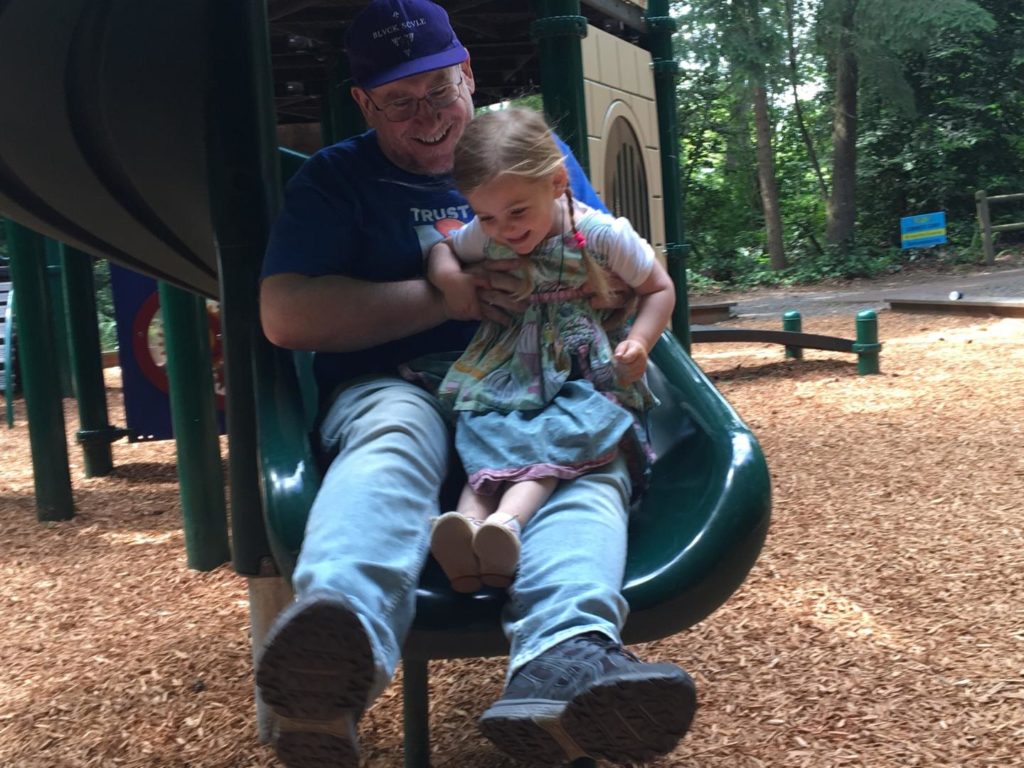 Grandpa Dale helps Olivia celebrate her third birthday